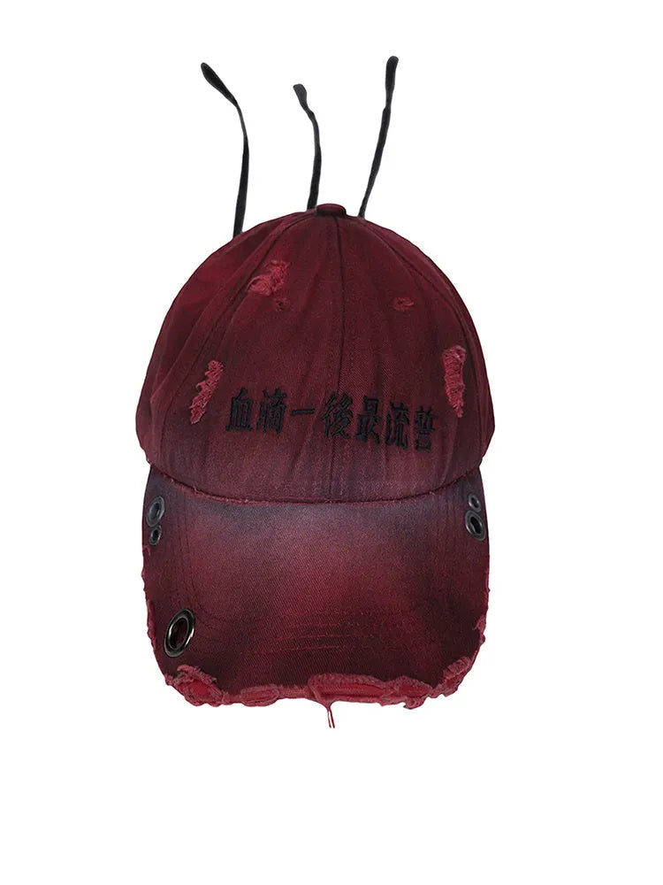Rose red cotton peaked cap with adjustable strap and structured peak