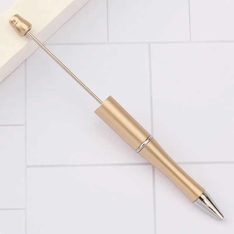 Rotating bead ballpoint pen in gradient colour with ABS plastic and steel wire construction