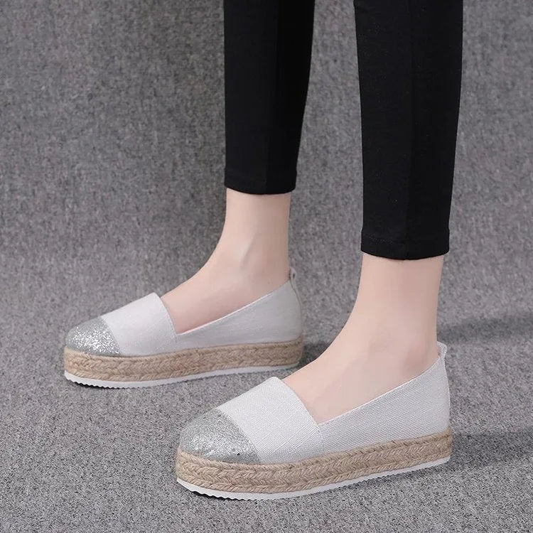 Breathable canvas slip-on flat shoes in black and white colours on a size chart showing 35 to 43.