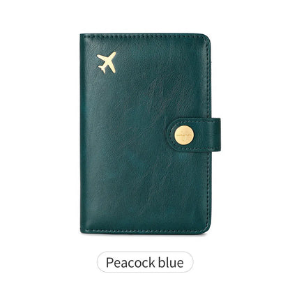 Simple PU leather passport holder in sapphire blue with visible sewing lines, showing card slots and RFID protection.