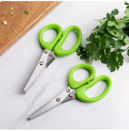 Green stainless steel multi-layer V-shaped kitchen scissors for cutting onions and herbs.