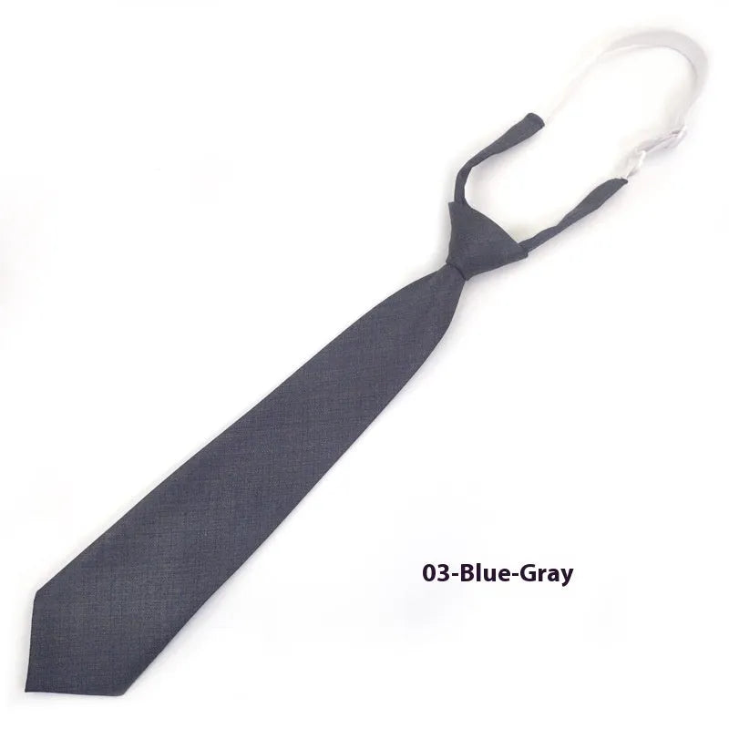 Men's navy blue cotton bow tie with arrow style shape on a white background.