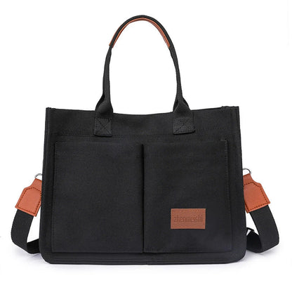 Premium canvas tote bag in multiple colors with adjustable shoulder strap and organizational pockets