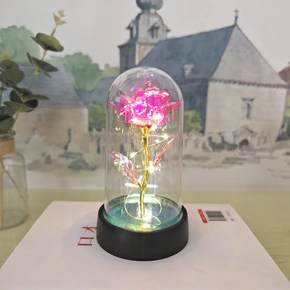Glass cover small night lamp with plastic flowers, 15cm height, black base, and multiple light colour options