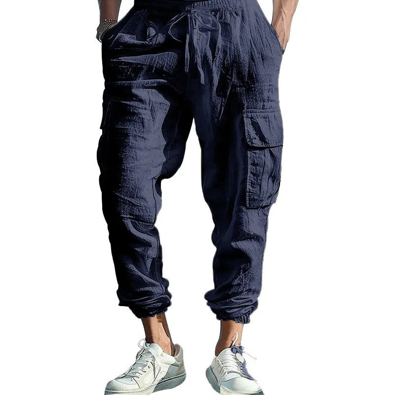 Men's linen trousers with ankle ties and multiple pockets in solid colour