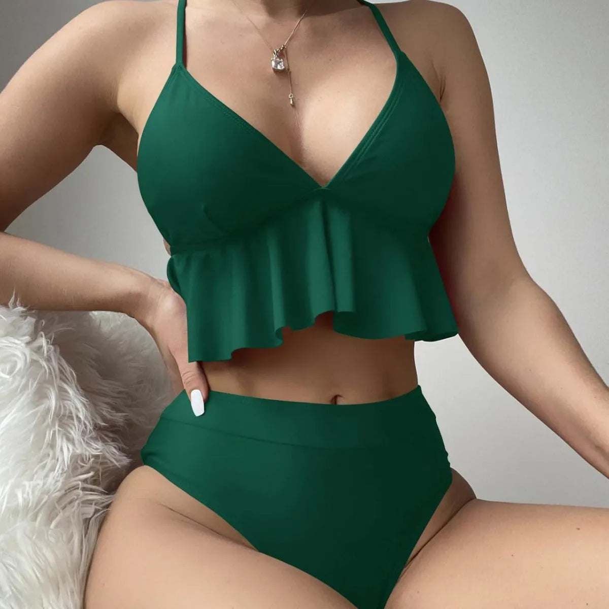 Women's solid colour split bikini swimsuit in black, green, red, or blue.