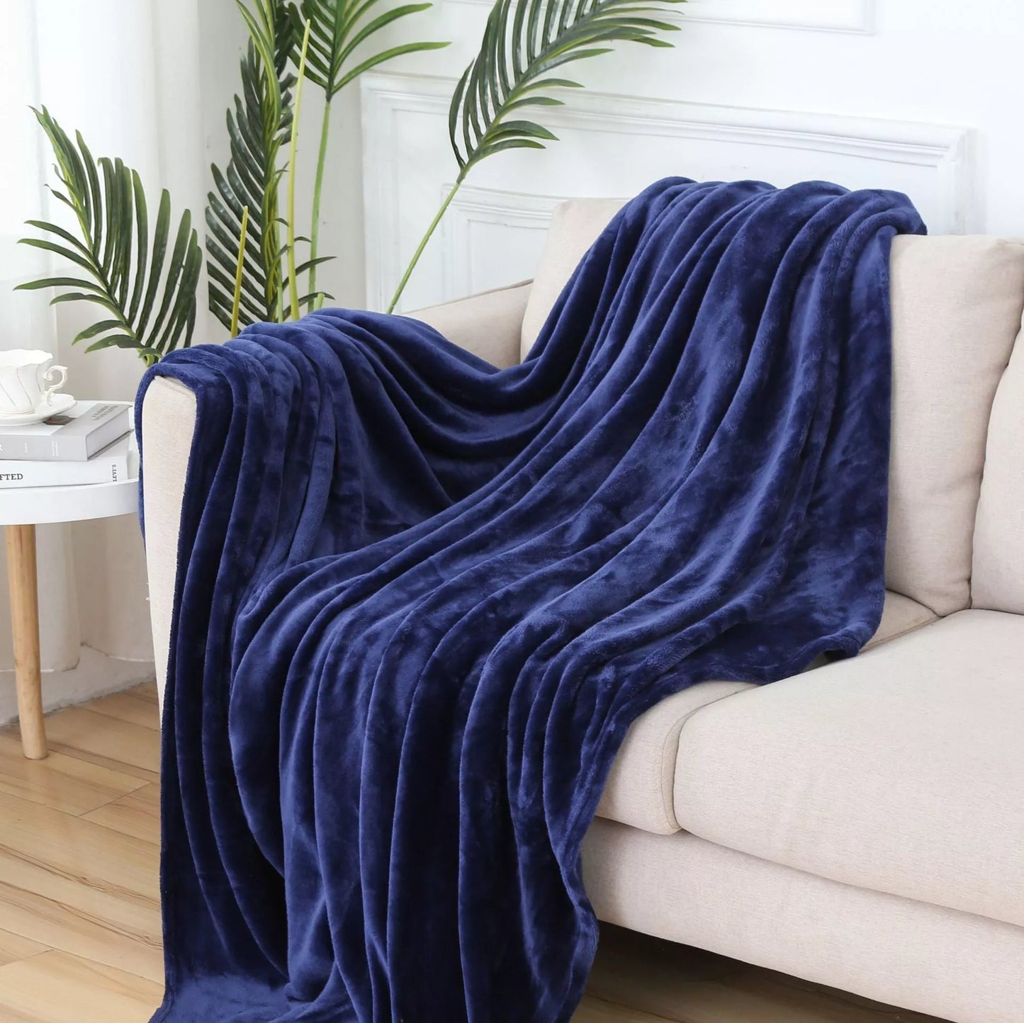 Solid color flannel blanket in various sizes and colors, made from durable polyester fiber