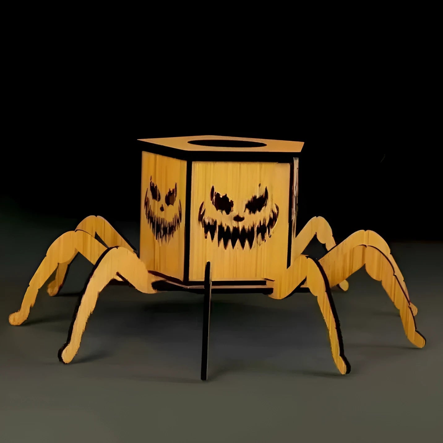 Tall wooden Halloween candlestick with spider cut-out illuminated by a safe, integrated LED light.