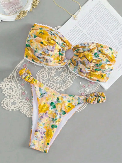 Colourful floral print tube top bikini set with lace trim on a mannequin
