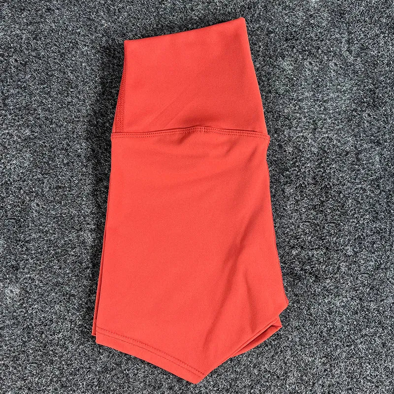 High-waisted yoga shorts in nylon fabric for moisture-wicking during sports, available in multiple colours and sizes.