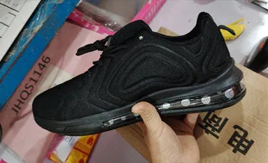 Men's black casual lace-up sneakers with a thick sole on a white background.