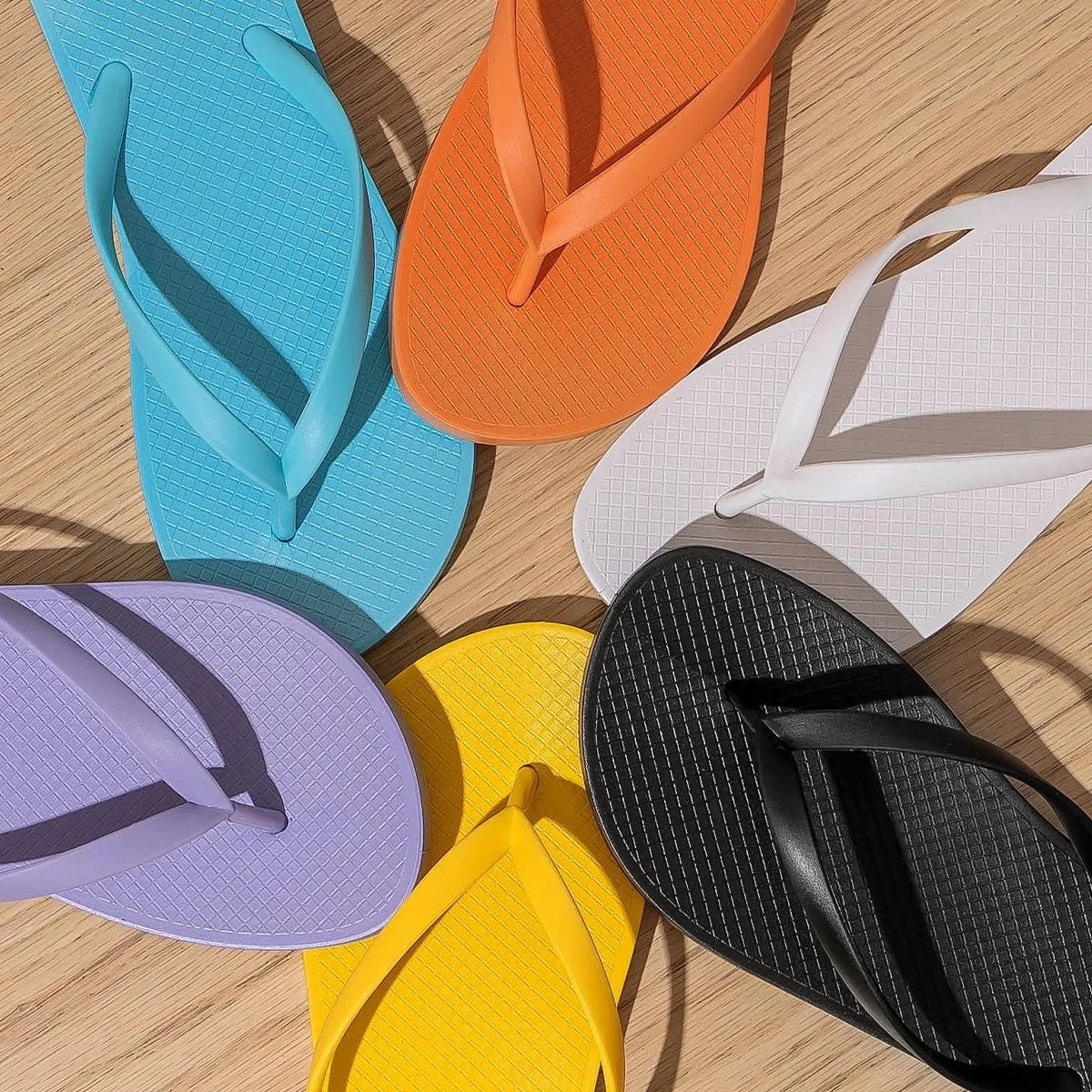 Foldable casual slippers with hollow-out plastic upper and non-slip PVC soles in black colour