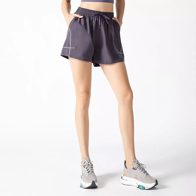 Women's fitness shorts in purple, black, and Brassica oleracea colors, sizes S to XL