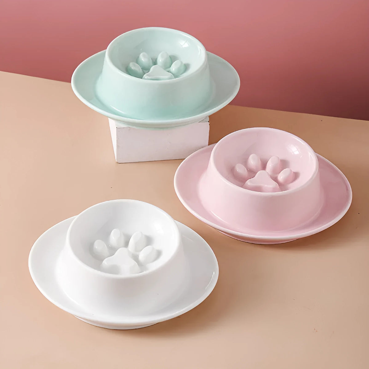 Green ceramic slow feeder bowl for pets with high walls and a non-slip rubber base.