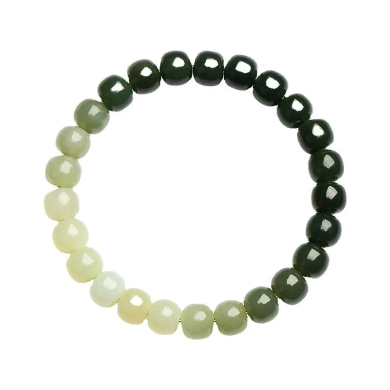 Natural Hetian jade bracelet showing gradient clear water colour on polished beads with either 6x7mm or 7x8mm dimensions