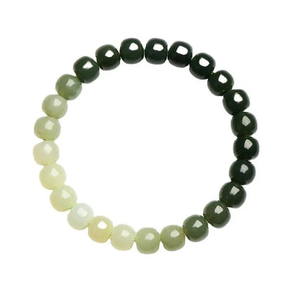 Natural Hetian jade bracelet showing gradient clear water colour on polished beads with either 6x7mm or 7x8mm dimensions