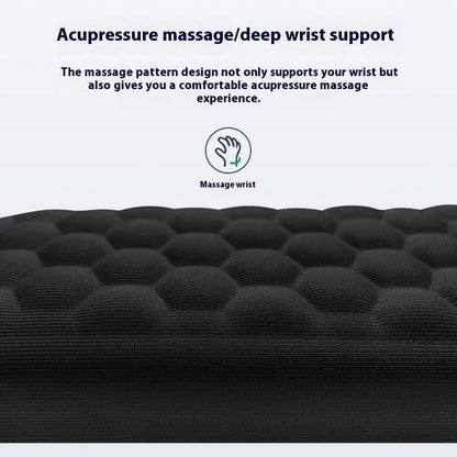 Black and grey memory foam mouse wrist rests with cloth and leather-style covers on a desk.