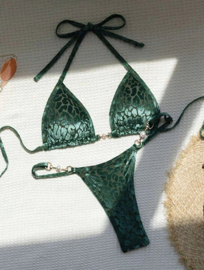 Women's blue leopard print T-shaped bikini set for swimming on a mannequin.