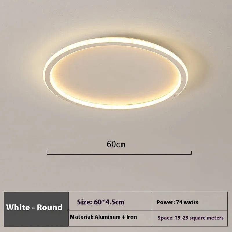 Minimalist circular ceiling lamp in gold finish mounted on a white ceiling
