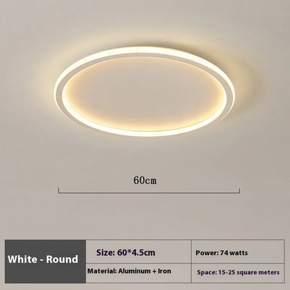 Minimalist circular ceiling lamp in gold finish mounted on a white ceiling