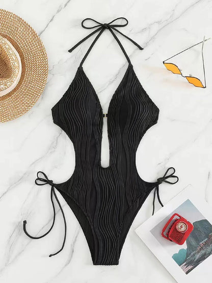 Women's black triangle bikini with white lace-up ties on the top