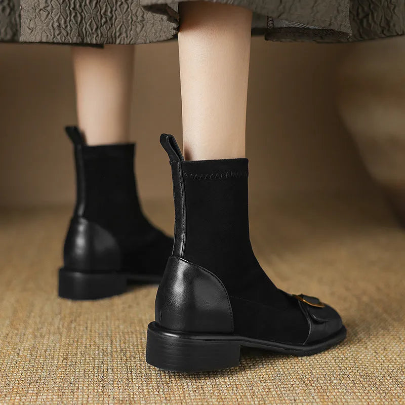 Women's black casual Martin boots with low heel, lace-up front, and decorative belt buckle stitching.
