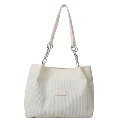Corduroy one-shoulder tote handbag in horizontal square shape with three-dimensional pocket