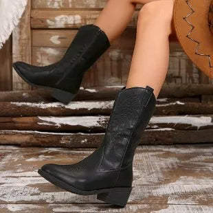Women's black ankle boots with chunky heel, pointed toe, and hollow out detail on mid-calf winter boots
