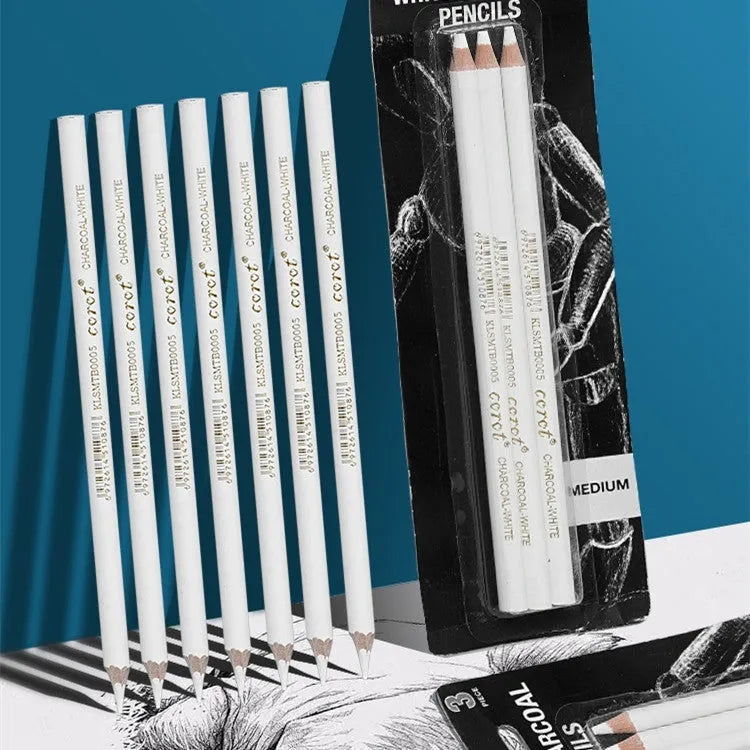 Three white charcoal pencils with wooden barrels for sketching on dark paper