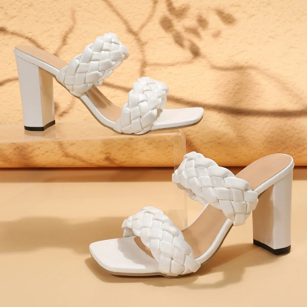 Women's square toe flip flops with woven PU straps and a chunky rubber sole in apricot colour.