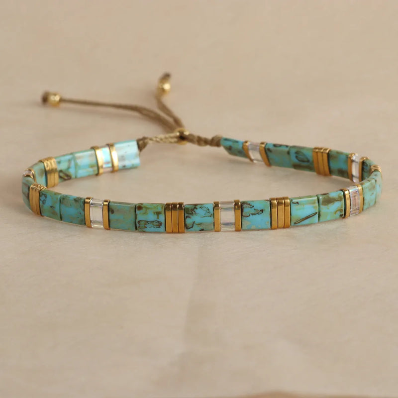 Glass beaded bracelet with geometric shapes in milky white, black, retro green, light blue, or red, a pull beads design bracelet for European and American fashion styling