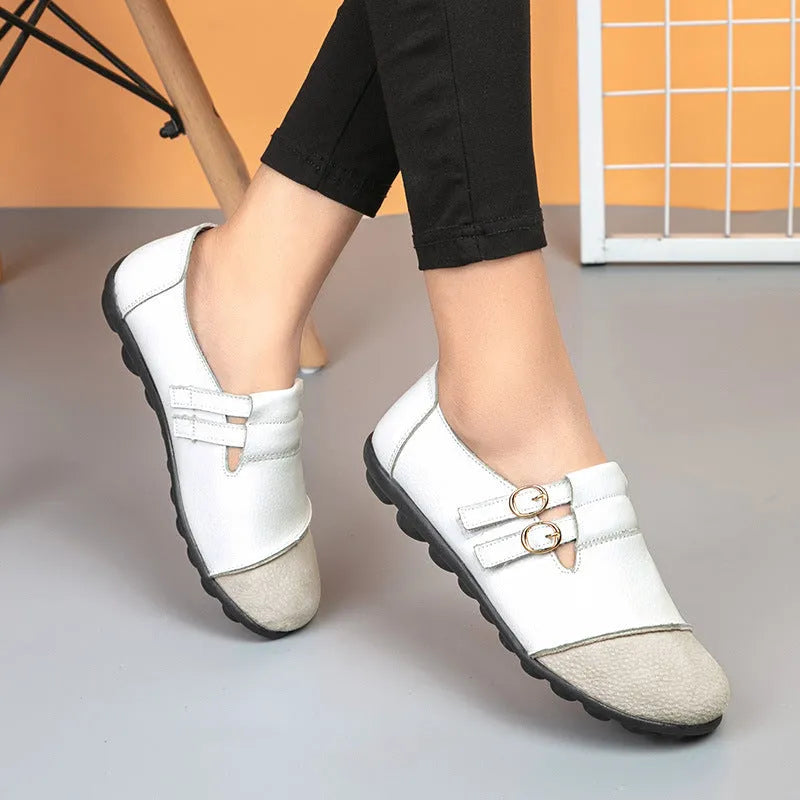 Women's low-top casual shoes in black with Velcro strap and rounded toe, showcasing cow split leather upper and beef tendon sole.