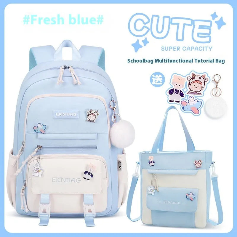 Pink waterproof Oxford cloth school backpack for girls with curved shoulder straps, shown with matching pencil case.
