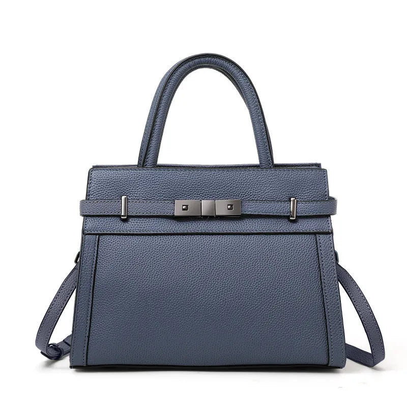 Women's genuine leather crossbody handbag in a horizontal square clamshell style, available in black, blue, elephant gray, green and OFF white, with a single shoulder strap and internal zip compartments for phone, documents and organisation