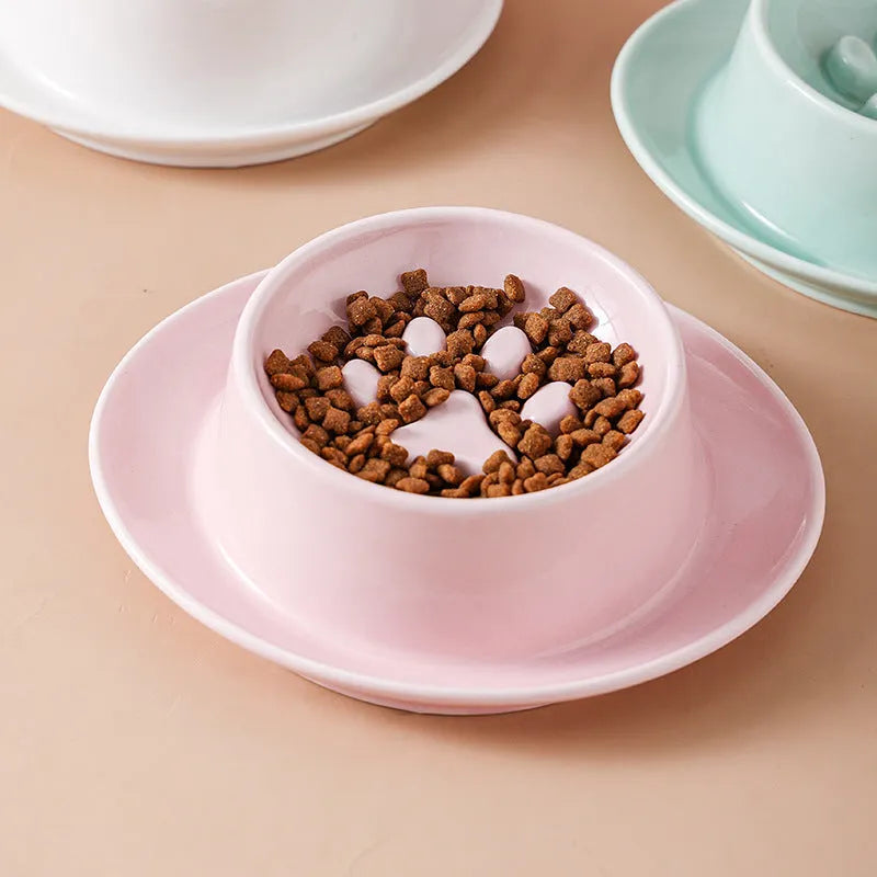 Green ceramic slow feeder bowl for pets with high walls and a non-slip rubber base.