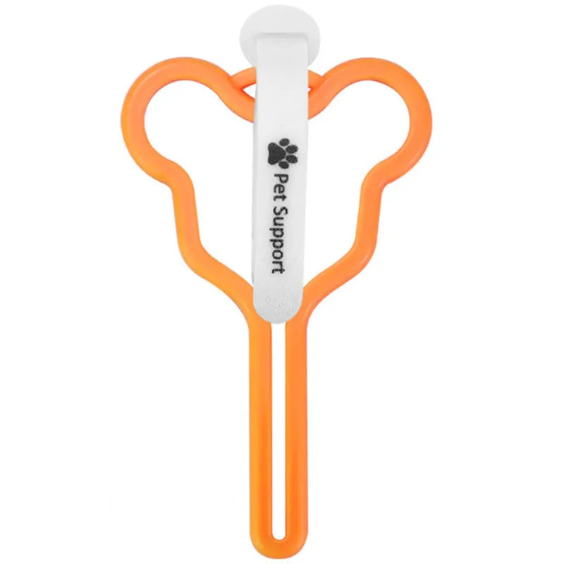 A dog poop bag dispenser with a hands-free clip and adjustable Velcro strap attached to a dog lead.