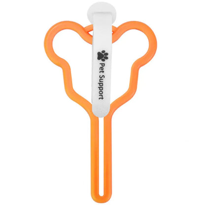 A dog poop bag dispenser with a hands-free clip and adjustable Velcro strap attached to a dog lead.