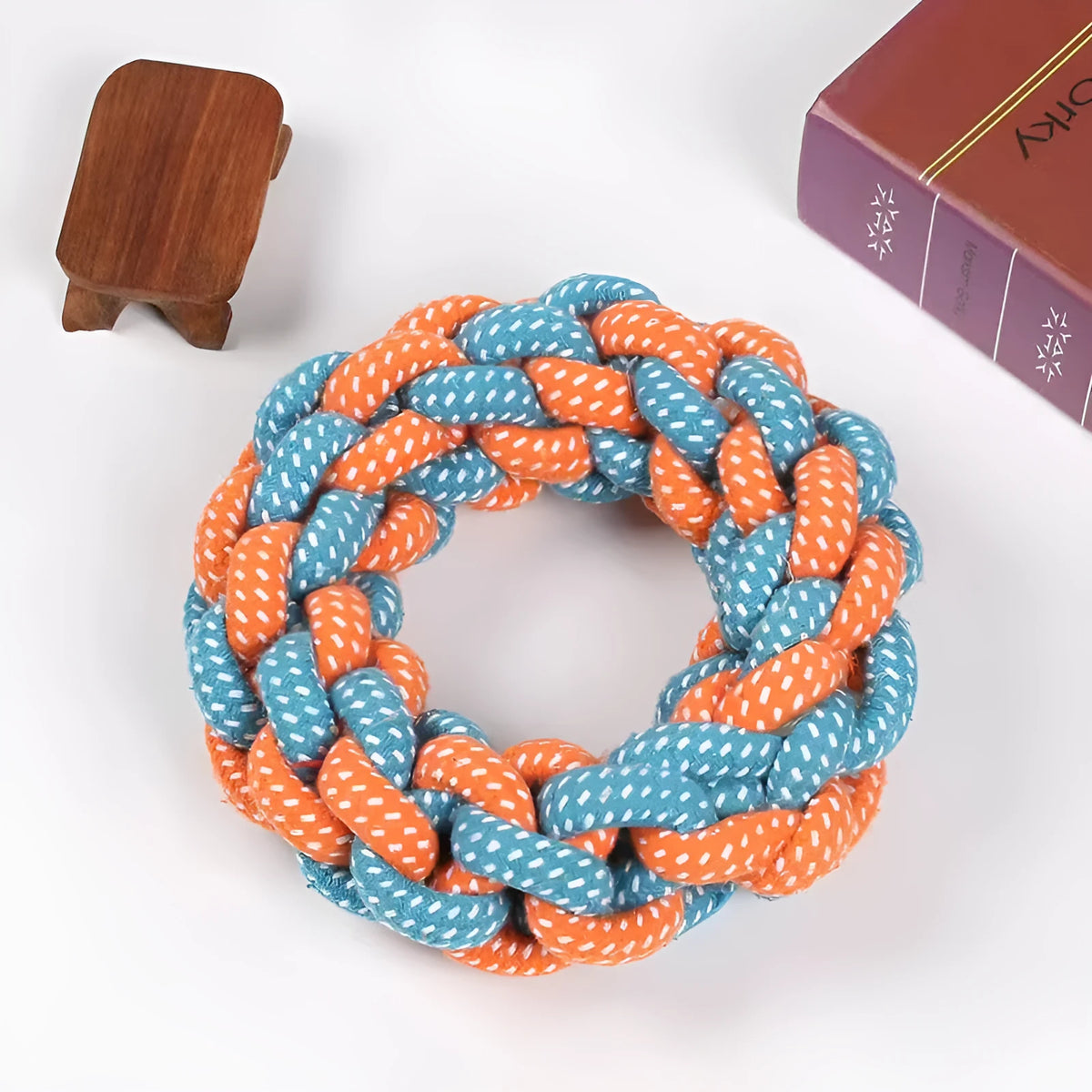 Cotton string braided ring knot dog chew toy showing woven texture and ring shape