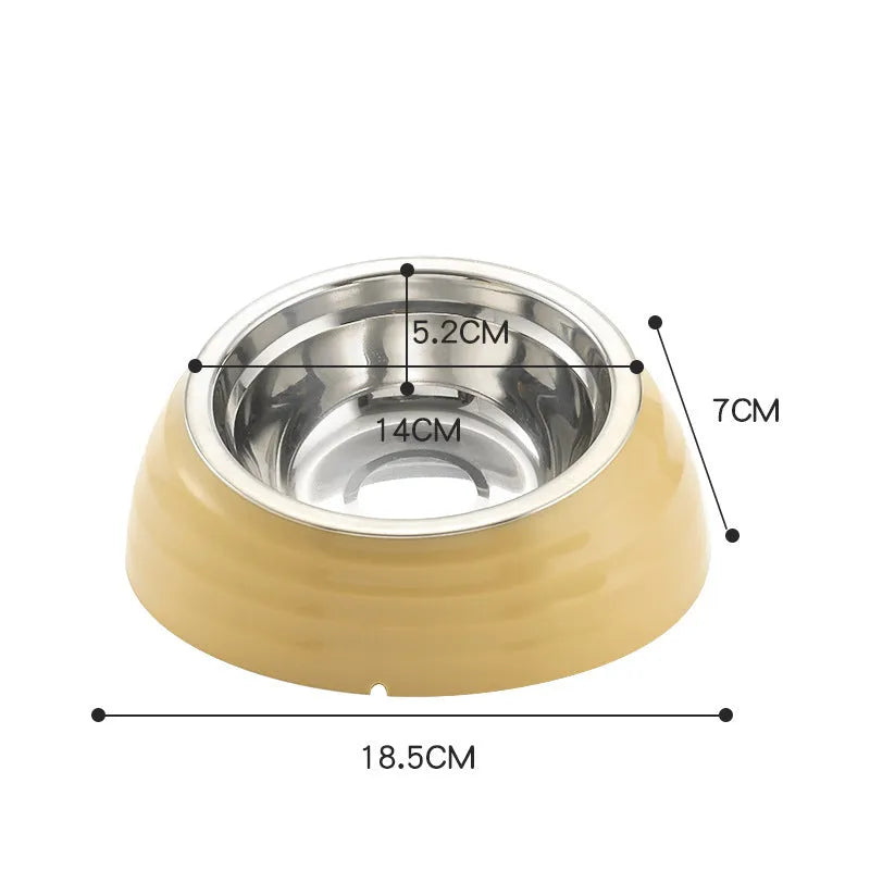 Single stainless steel cat bowl with a light green plastic base on a floor.