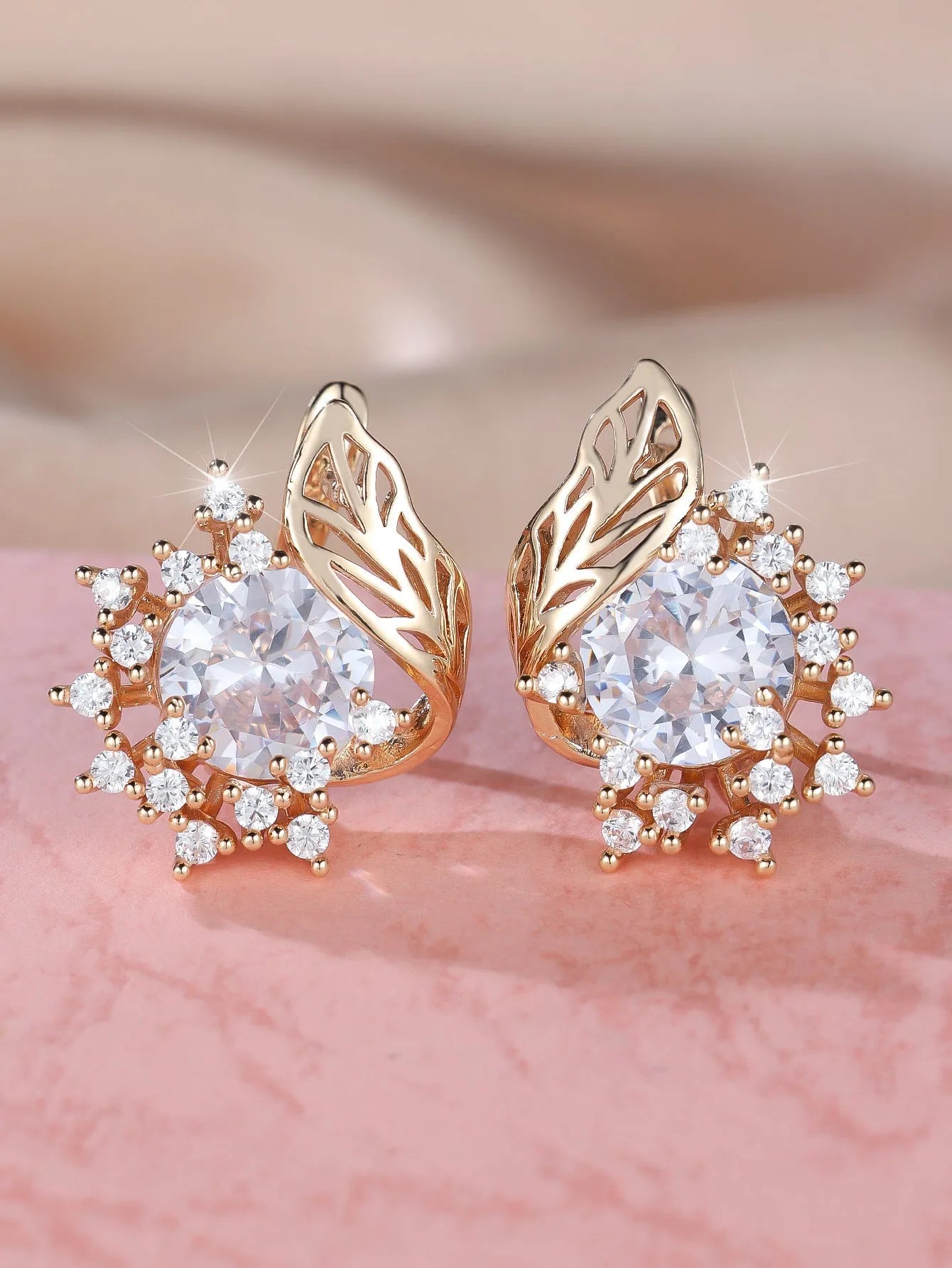 Round flower and feather design earrings in champagne gold with a choice of coloured zircon stones.