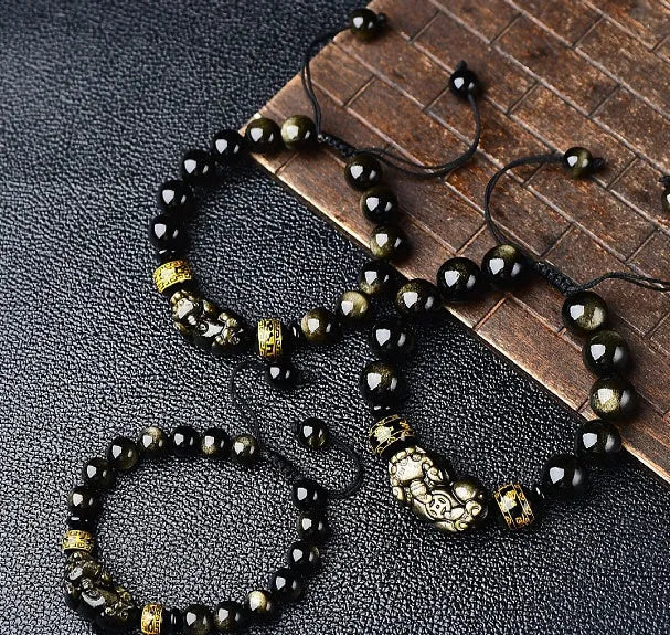 Hand-woven golden obsidian Pi Xiu bracelet with animal design, showing bead size options.