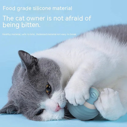 Blue automatic cat toy ball bouncing on floor with silicone construction and rechargeable design