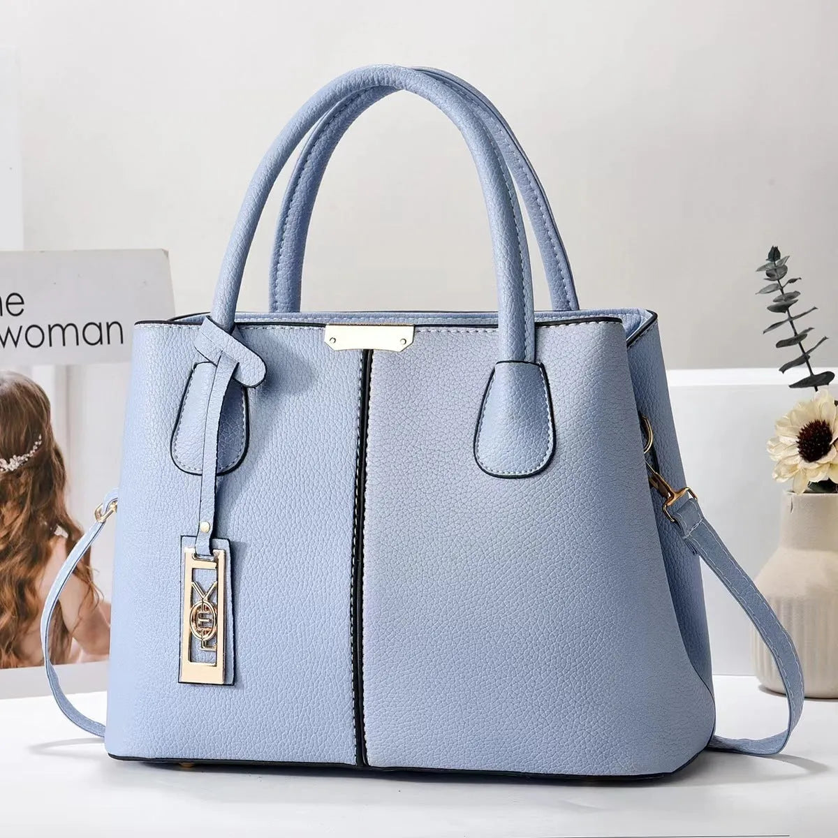 Soft PU leather large capacity shoulder bag in a horizontal square shape with an adjustable strap