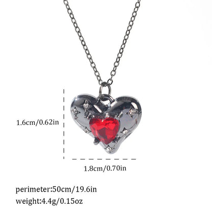 Gothic style zinc alloy necklace with bat pendant on a silver chain against dark background.