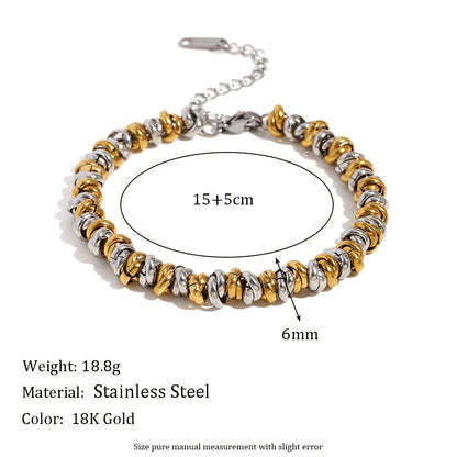 Gold electroplated stainless steel earrings, necklace, and bracelet set with geometric shapes and round ring elements