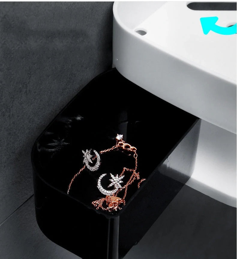 Double-layer wall-mounted storage shelf in black and grey, showing rotating feature and compartments