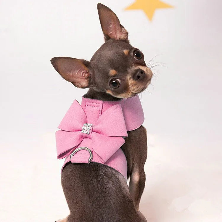 Puppy wearing a pink microfiber chest strap with a bowknot, adjustable in sizes S, M, L, XL