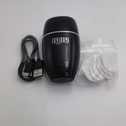 Black and white electric lip plumper device with silicone tip and USB cable