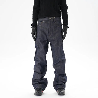 Man wearing dark blue loose-fit straight-leg denim jeans, showcasing the casual relaxed silhouette.