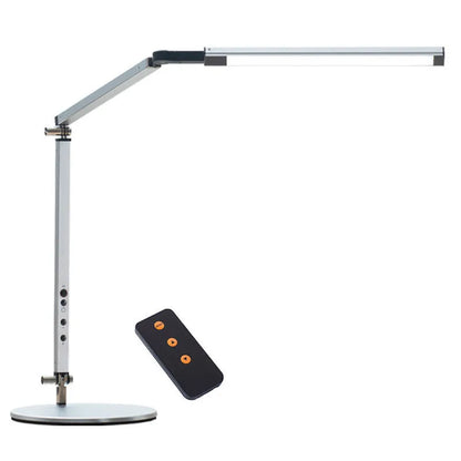 Clip-on adjustable arm LED desk lamp in black mounted on a desk edge with remote control.